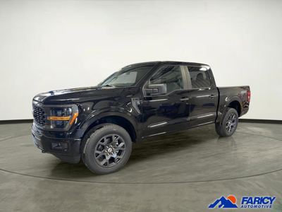 Black Ford F-150 pickup in a dealer showroom