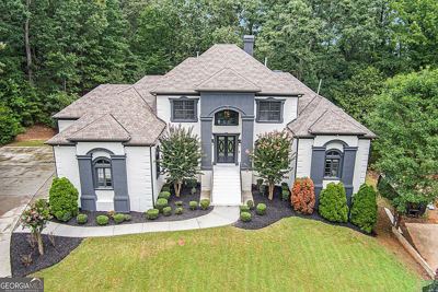 Front of a large two-story house with a lawn